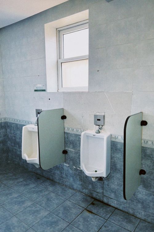 Clean urinals in a commercial restroom