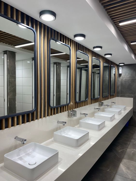 Clean sinks and mirrors in a public restroom
